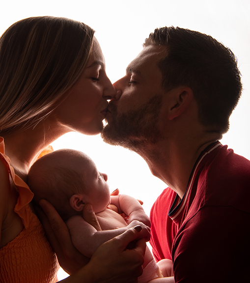 Parents with newborn baby in a lifestyle family photo shoot